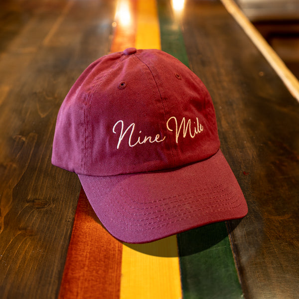 White "Nine Mile" Script, Maroon Hat